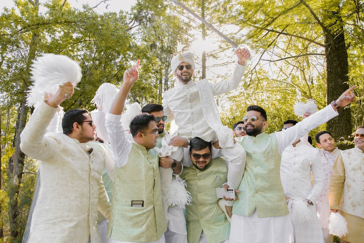 Groom's Barajatri procession with drums approaching the venue gate